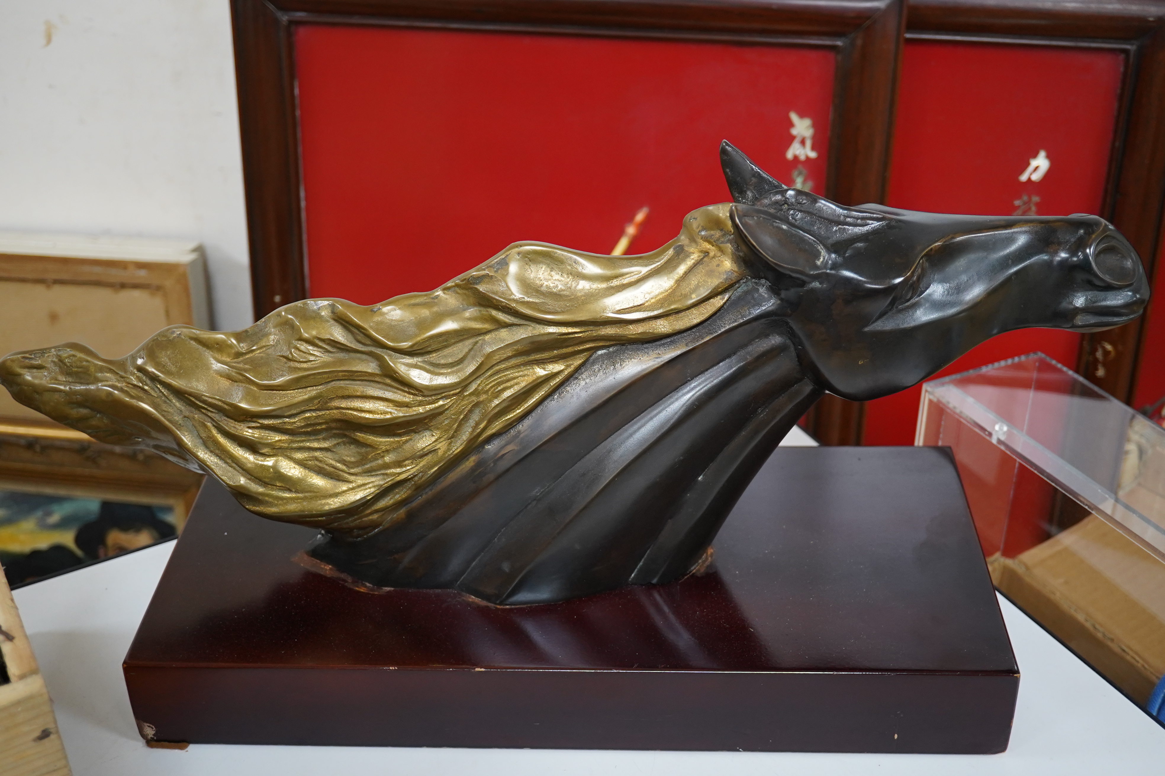 A French Art Deco patinated brass model of a horses head, unsigned, 60cm wide. Condition - fair to good